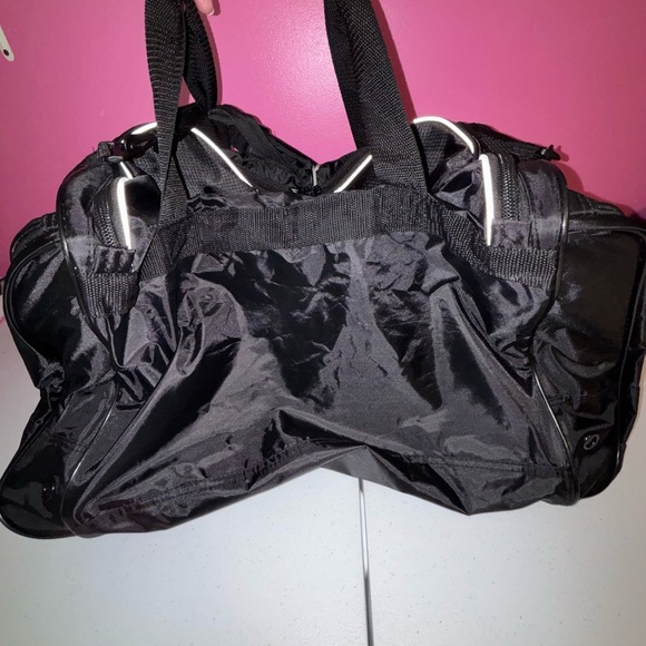 Black Duffel Bag with White Accents and Modern Design - Picture 3 of 13